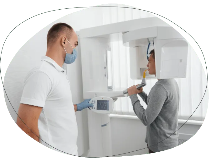 A dentist positioning a patient for a 3D dental scan