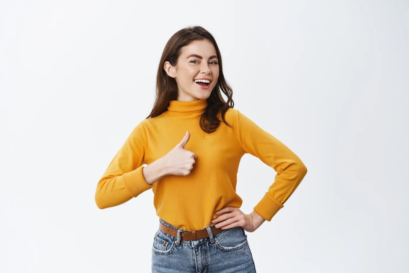 A smiling woman giving a thumbs up