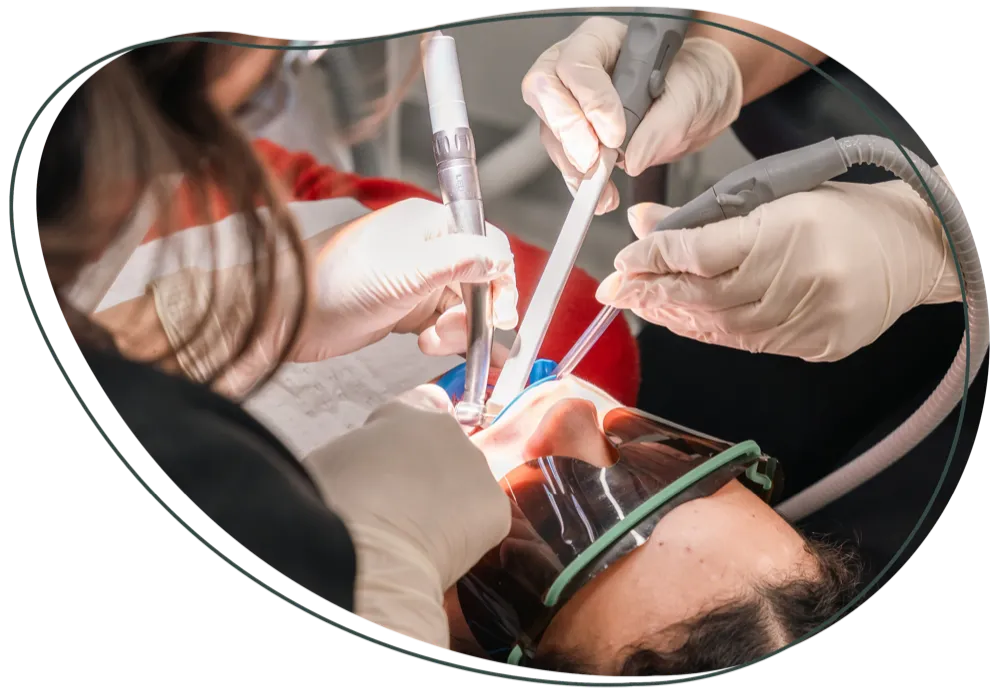 A patient in protective glasses during dental treatment